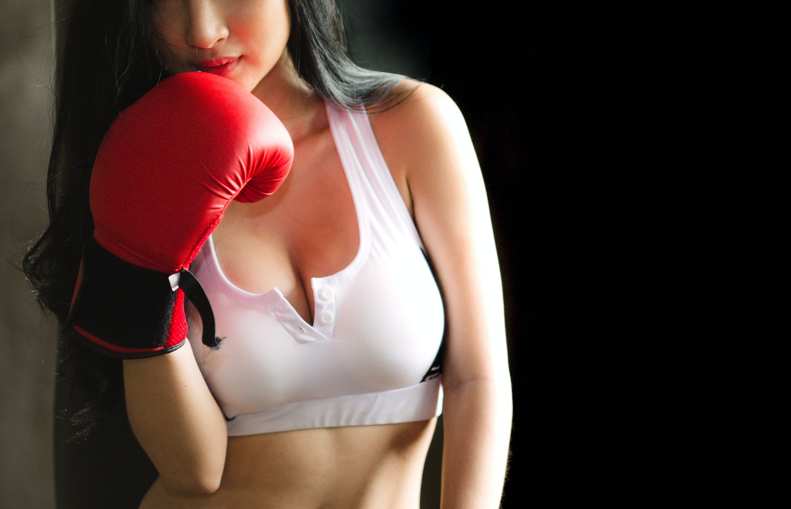 Woman in White Sports Bra and Red Boxing Glove